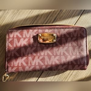 Slightly used maroon Michael kors wrislet